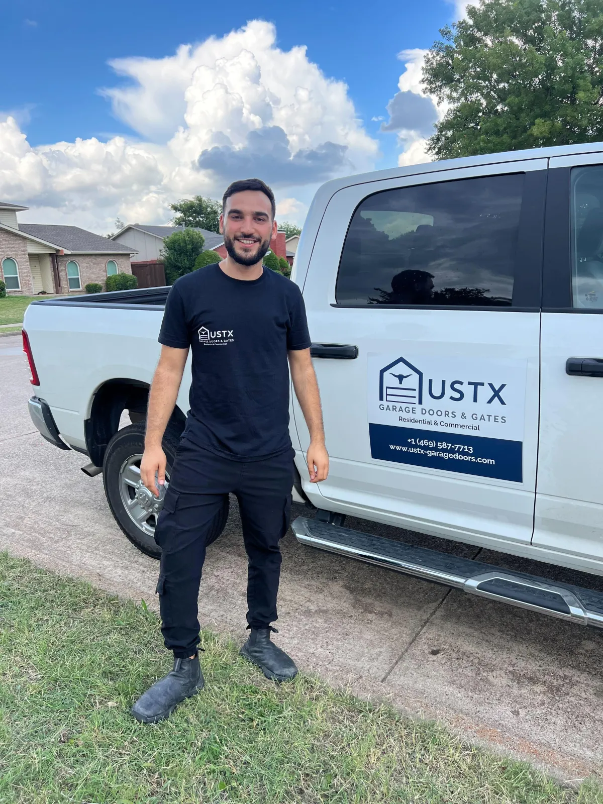 USTX Garage Doors & Gates owner standing next to company service truck in DFW