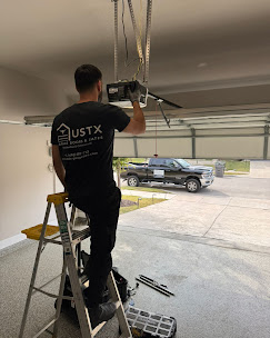 USTX technician repairing a garage door opener